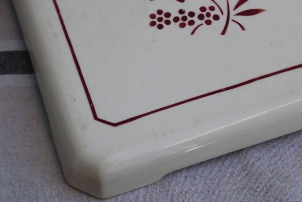 Ancien dessous de plat en céramique