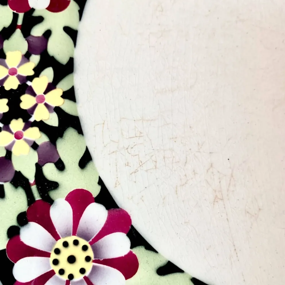 Ancien dessous de plat en céramique - décor floral