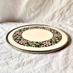 Ancien dessous de plat en céramique - décor floral