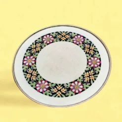 Ancien dessous de plat en céramique - décor floral