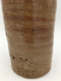 Ancienne bouteille en terre cuite vernissée, début XXème siècle