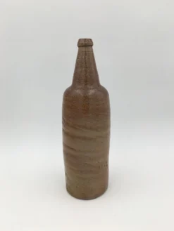 Ancienne bouteille en terre cuite vernissée, début XXème siècle