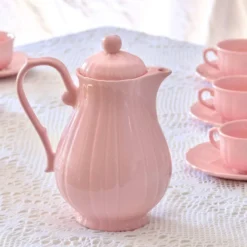 Ancien service à café de Salins-les-Bains en faïence rose