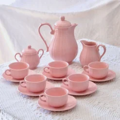 Ancien service à café de Salins-les-Bains en faïence rose