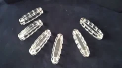 6 anciens porte-couteaux en verre moulé