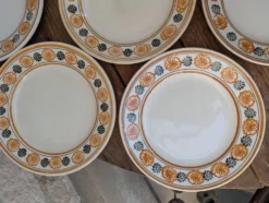 10 assiettes à dessert Saint Amand Amandinoise frise fleurs orange et noire