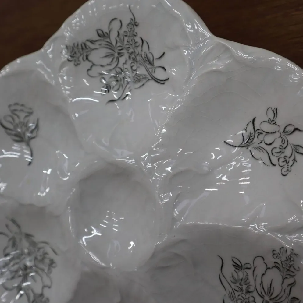 9 Assiettes à huîtres décor fleuri noir KetG Luneville année 1940
