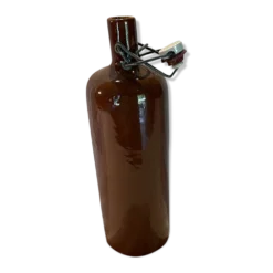Bouteille ancienne en grés avec un bouchon mécanique en porcelaine