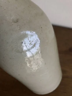 Bouteille de grès penchée début 20e