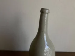 Bouteille de grès penchée début 20e