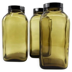 3 bouteilles de pharmacie en verre ambré moulé • bouchons bakélite • 1950