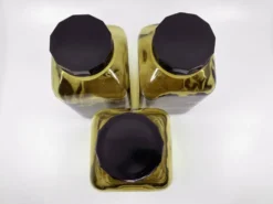 3 bouteilles de pharmacie en verre ambré moulé • bouchons bakélite • 1950