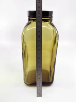 3 bouteilles de pharmacie en verre ambré moulé • bouchons bakélite • 1950