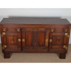Buffet en chêne et laiton dans le goût de Charles Dudouyt, 1940