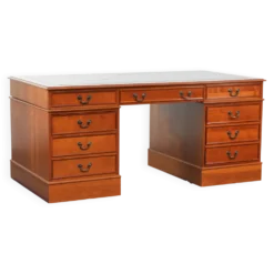 Bureau en bois classique de style anglais avec 4 tiroirs et un dessus en cuir bleu.
