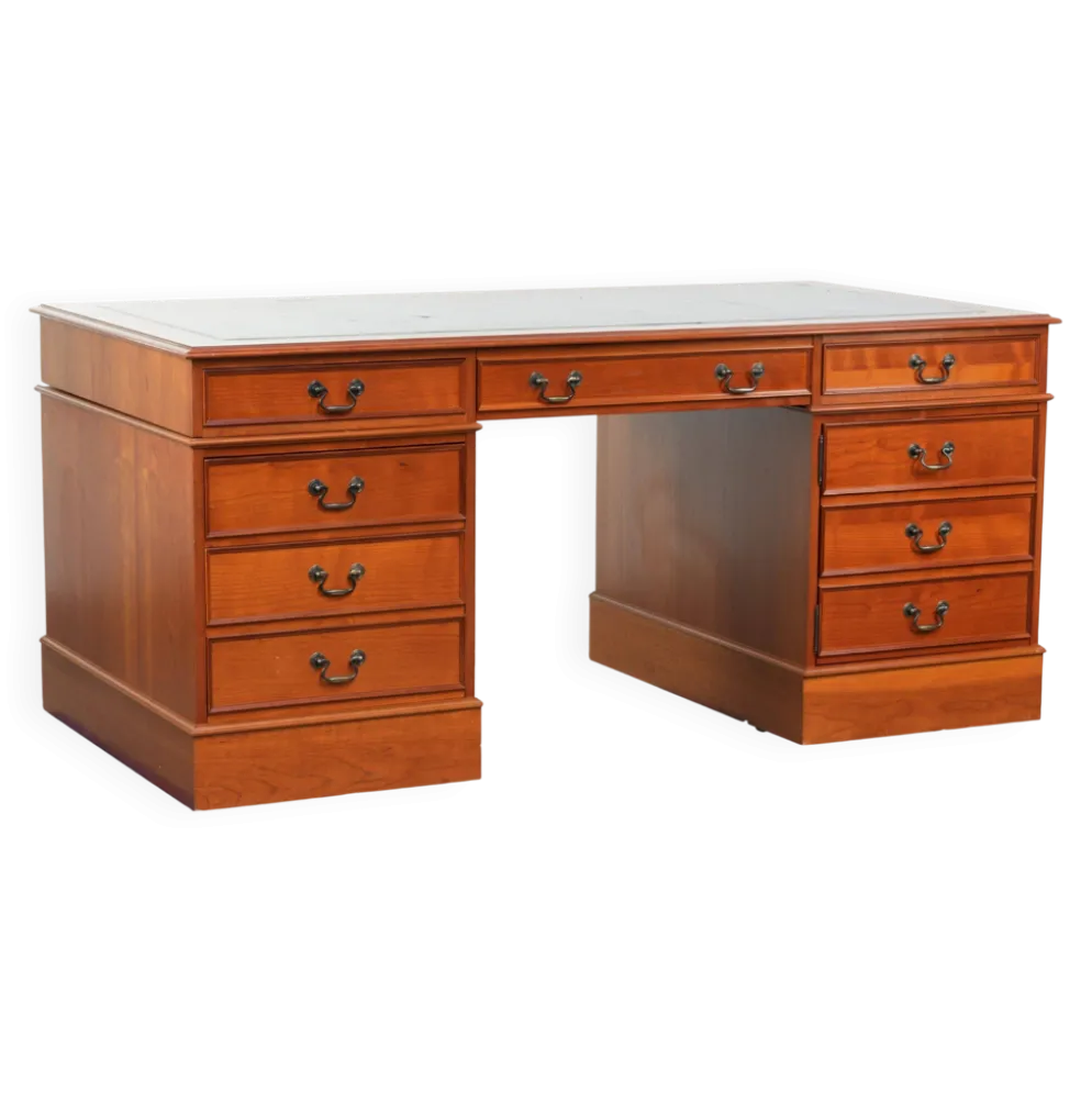 Bureau en bois classique de style anglais avec 4 tiroirs et un dessus en cuir bleu.