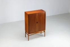 Cabinet haut danois en teck avec portes tambour Danemark 1960