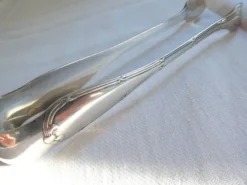 Christofle Pince à sucre en métal argenté modèle noeuds rubans croisés