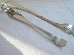 Christofle Pince à sucre en métal argenté modèle noeuds rubans croisés