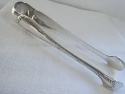 Christofle Pince à sucre en métal argenté modèle noeuds rubans croisés