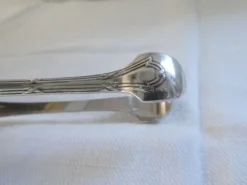 Christofle Pince à sucre en métal argenté modèle noeuds rubans croisés