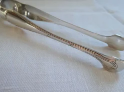 Christofle Pince à sucre en métal argenté modèle noeuds rubans croisés