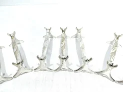 Christofle - série de 11 porte-couteaux en métal argenté