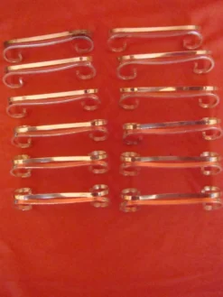 Coffret de 12 porte-couteau en métal argenté avec écrin, époque début 20 ème