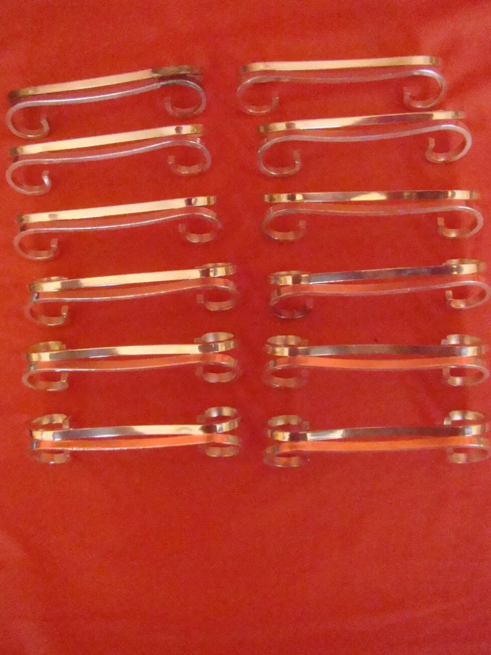Coffret de 12 porte-couteau en métal argenté avec écrin, époque début 20 ème
