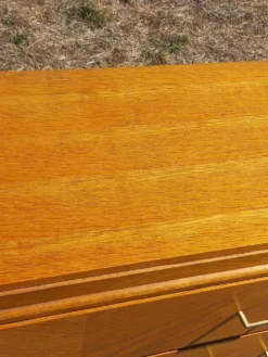 Commode vintage en chêne blond pieds compas 4 tiroirs des années 50