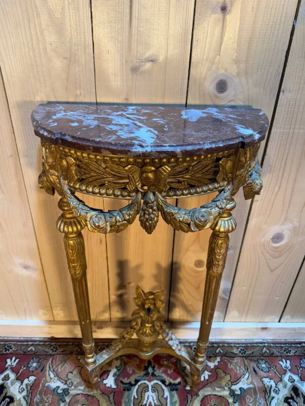 Console de style Louis XVI en bois doré et sculpté
