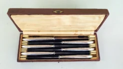6 couteaux en métal argenté
