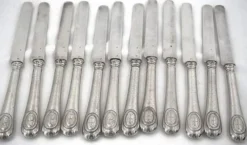 12 couteaux à fruits, lames et manches argent Minerve, guillochés, Napoléon III.
