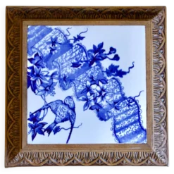 Dessous de plat en terre de fer Longwy décor à l'oiseau, XIXe siècle