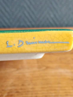 Dessous de plat signé l. drimmer en céramique émaillée jaune