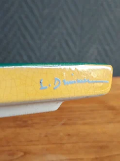 Dessous de plat signé l. drimmer en céramique émaillée jaune