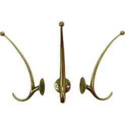 Deux porte-manteaux muraux courbés en laiton par Franz Hagenauer, Vienne, milieu du 20e siècle, années 1950.