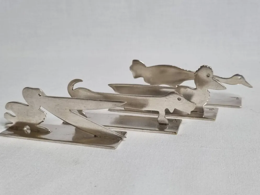 Ensemble de 8 porte-couteaux animaliers Yorel Art Déco métal argenté 1930