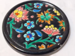 Ensemble émaux de Longwy dessous de plat et de bouteille décor floral