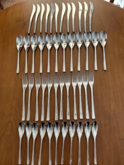 Exceptionnelle ménagère Couzon Neuvième Art – 123 pièces – inox 18/10