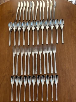 Exceptionnelle ménagère Couzon Neuvième Art – 123 pièces – inox 18/10