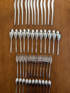 Exceptionnelle ménagère Couzon Neuvième Art – 123 pièces – inox 18/10