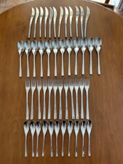Exceptionnelle ménagère Couzon Neuvième Art – 123 pièces – inox 18/10