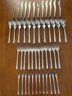 Exceptionnelle ménagère Couzon Neuvième Art – 123 pièces – inox 18/10