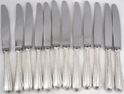 François Frionnet, 12 couteaux de table en métal argenté, filet simple, Albi.