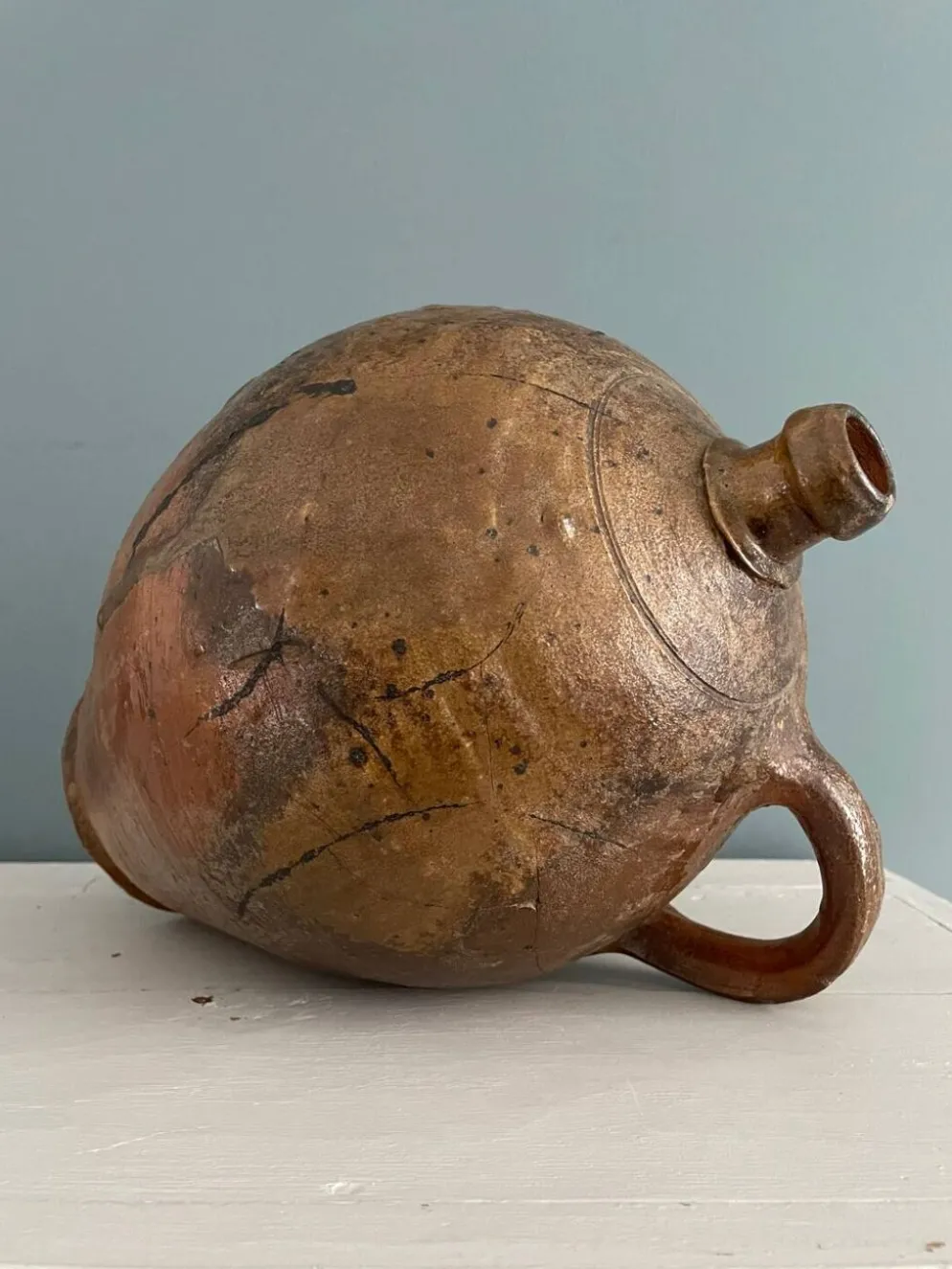 Grande bouteille à huile XIXème en terre vernissée