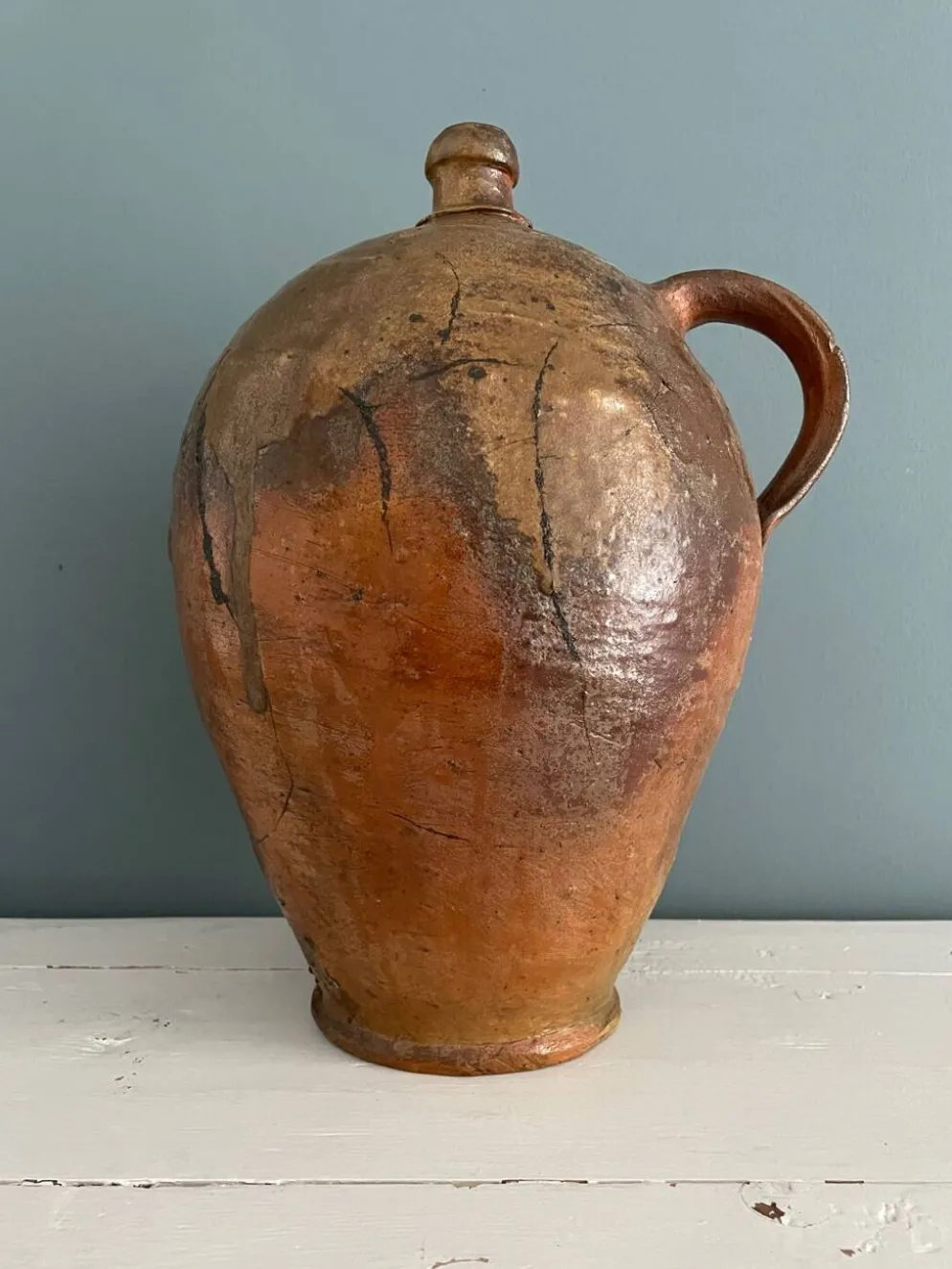 Grande bouteille à huile XIXème en terre vernissée