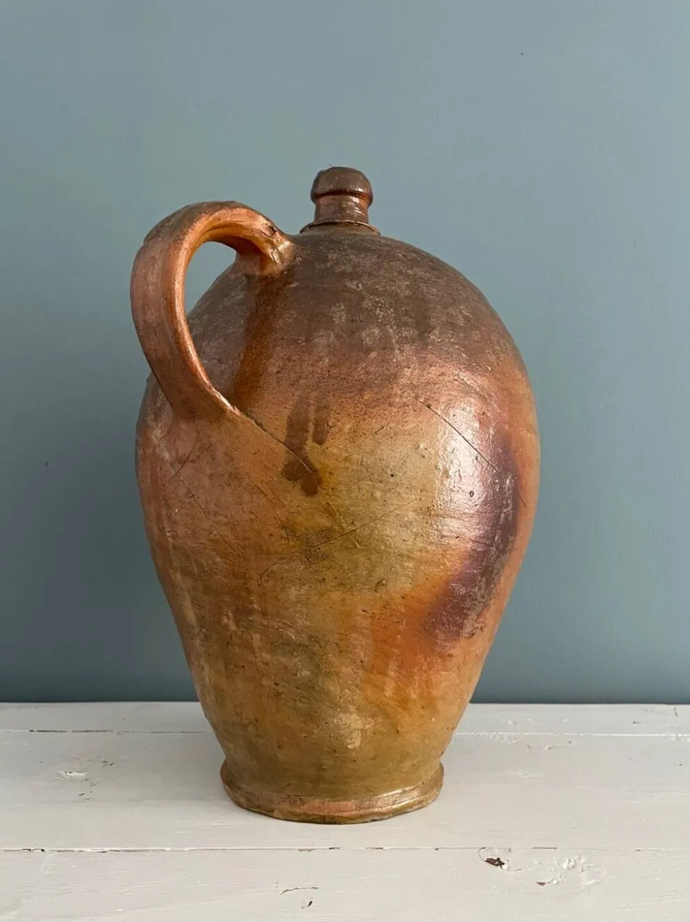 Grande bouteille à huile XIXème en terre vernissée
