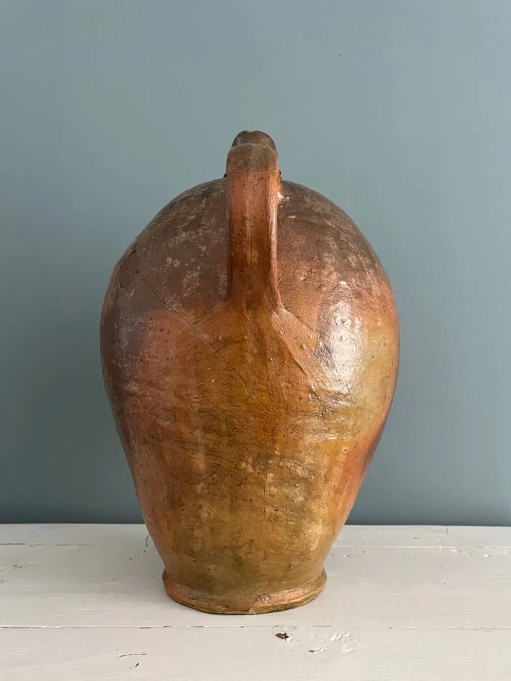 Grande bouteille à huile XIXème en terre vernissée