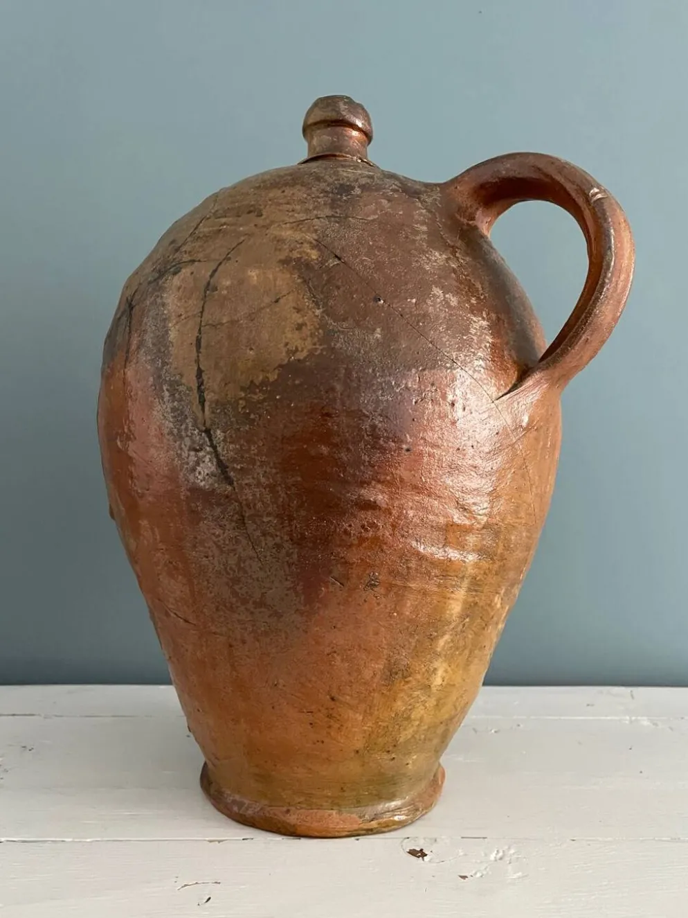 Grande bouteille à huile XIXème en terre vernissée